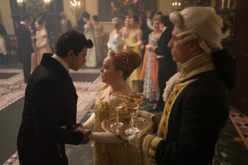 Colin taking Penelope's hands in a public scene in S2
