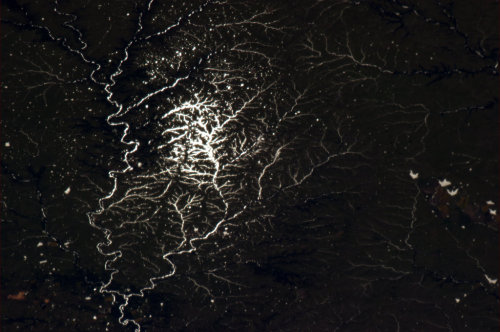 colchrishadfield: Sun glint turns a thousand miles of rivers into a single veined leaf.