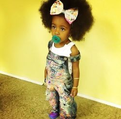 naturalhairqueens:  This little girl is so beautiful with her swag and her fro, and her cute little bow! Black girls are magical. 