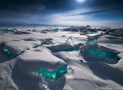 aquaticwonder:  Shades of Turquoise Ice  In the winter, for about five months or from January to May, the lake freezes over but the water is so clear that, from the surface, you can see an astounding 130 feet below you. Transparent and shining in a