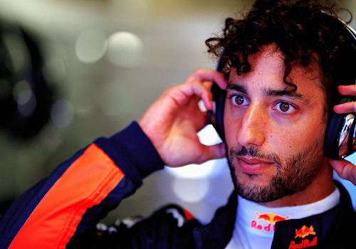 thegameswelove:Daniel Ricciardo of Australia and Red Bull Racing prepares to drive in the garage dur