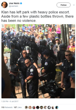 solarrapple:  lagonegirl:    This is so wrong it pains me.   Meanwhile  Amerikkka  well obviously the KKK were looked after, half of them are off duty cops. This was just a family reunion for them