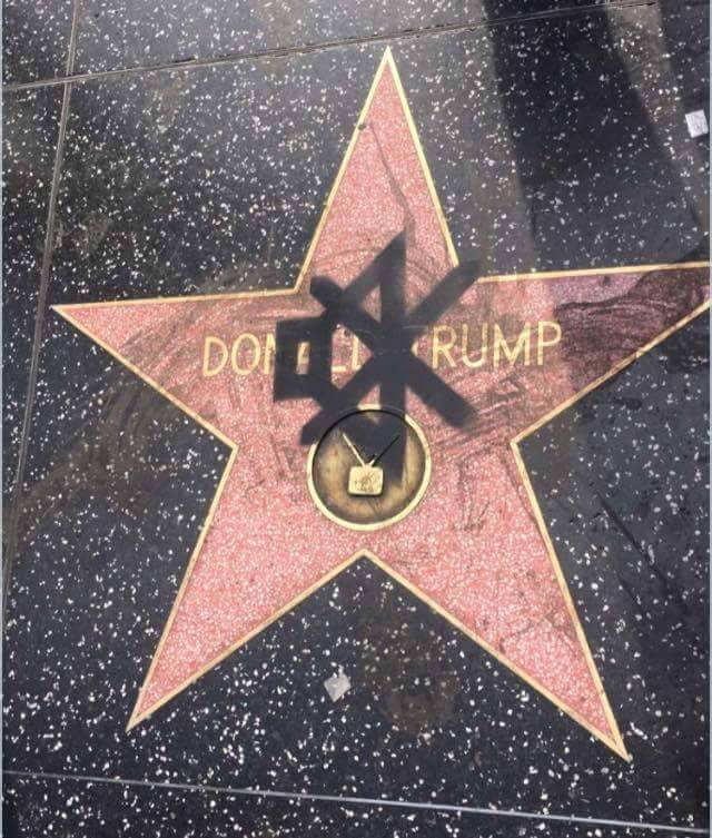 gokuma:  pleatedjeans:  Someone spray painted a mute symbol on Donald Trump’s Hollywood