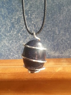 penisauris-r3x:  setbabiesonfire:  Blue Goldstone wrapped in Sterling Silver, pendant handmade by me. (:  omg I want it