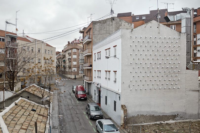 lustik:  CAMERAS, “Installation of 150 fake security cameras on building facade