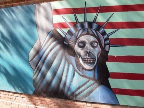 Anti-American murals painted on the old US embassy in Tehran