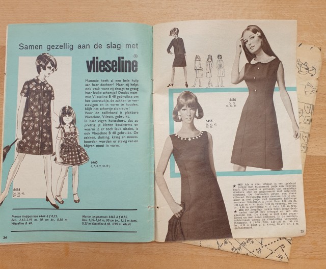 black white and blue pages showing an ad for vlieseline(iron on interfacing) and models in black dresses with interesting looped hairstyles 