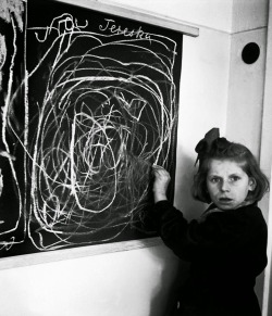 sixpenceee:Tereszka who grew up in a concentration camp was asked to draw “home” and what she drew was scribbles. It shows how the horrors of the concentration camp warped her mind. This photograph was taken by David Seymour in 1948. 