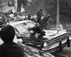 historicaltimes:  A police car strikes a