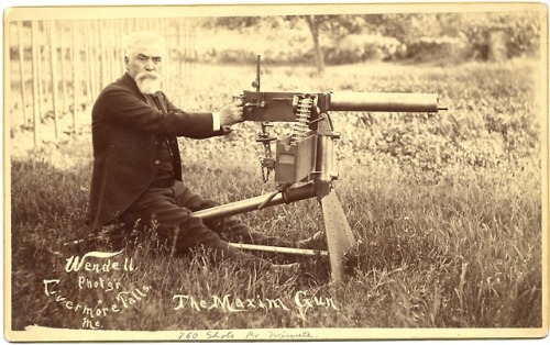 historicaltimes:Hiram Maxim posing with his invention, The Maxim Gun, the world’s first fully automa