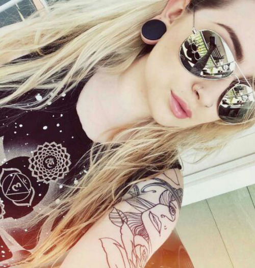 i like the idea of having a portrait at the top of a flower sleeve tattoo