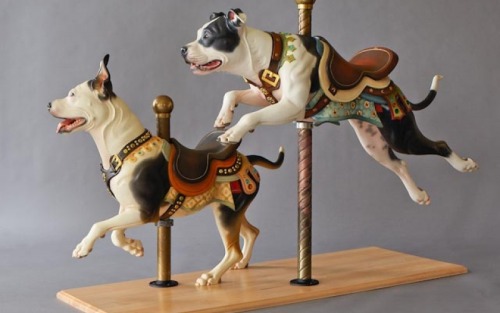 bochelly:  OH MY GOD THIS ARTIST. HE IS AMAZING. DOGS AND CAROUSELS. HE MAKES CUSTOM CARVED DOGS. 