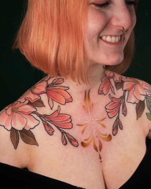 allthepiercingsandbodymods:Flower chest, shoulder and neck tattoos by @Jentonic. Follow her on Insta