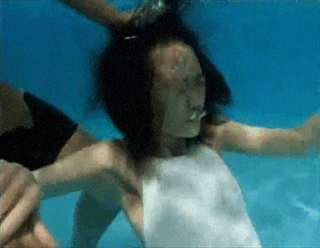 Women Blowing Bubbles Underwater