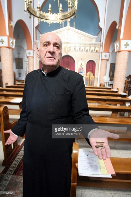 speciesbarocus:A priest shows bullets following an attack at a church in Nablus, on 16 September 200