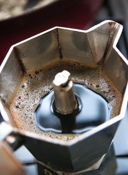 welcometoitalia:  The moka pot - macchinetta del caffè - is a stove-top coffee maker that produces coffee by passing boiling water pressurized by steam through ground coffee. It was patented in Italy by inventor Luigi De Ponti for the Alfonso Bialetti