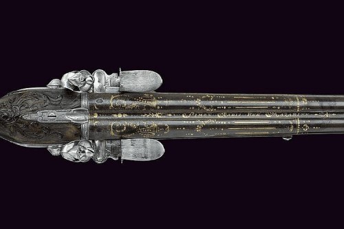peashooter85:  An ornate silver mounted double barrel flintlock rifle signed Charles Simon.  Charles Simon was the master gunsmith for King Louis XVI from 1765 to 1796.