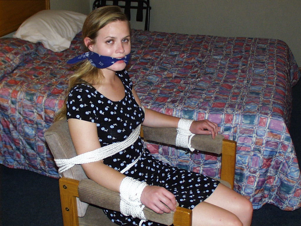 graybandanna:  Tied to a chair with a big blue bandanna gag 