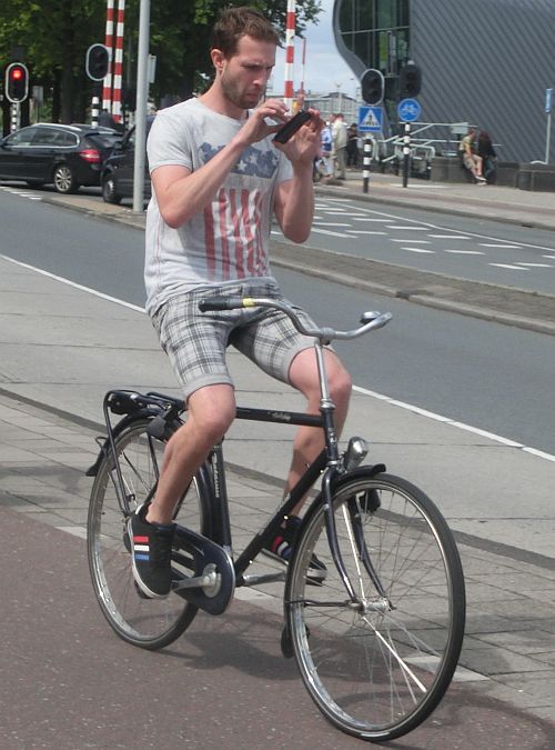 multitasking-man-multitasking-on-old-school-men-s-bike