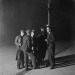 undr:Daily Herald Archive. A group of unemployed men gathered round a streetlight.