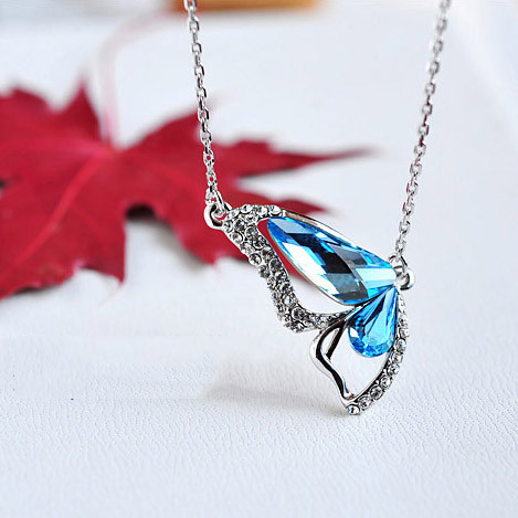 Full of whimsy and wonder, this intricate butterfly wing design necklace is delicately crafted from 