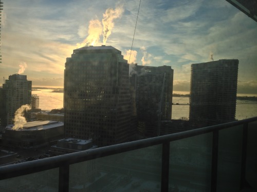 I love the way that the sunrising and steam off the buidlings almost look like fire. :)
I love that I get to wake up to this view every morning. Oh, and that’s Lake Ontario right there.