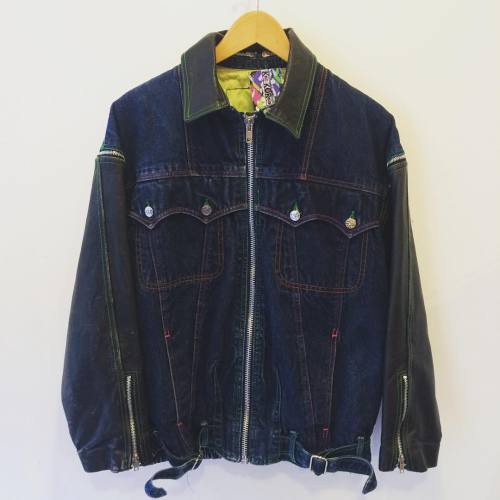 Amazing vintage 90s denim biker style jacket with zip off leather sleeves and collar and Afrocentric