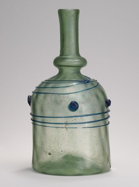 Bottle, 12th century CE. Probably Syrian. Mold–blown and tooled glass with applied decoration; H. 6 