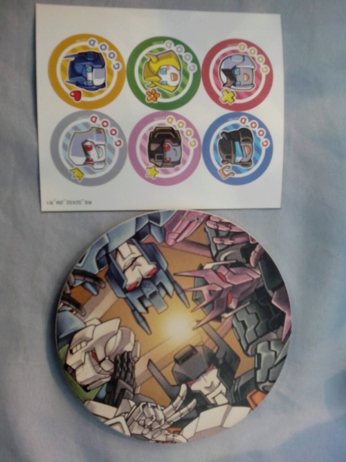 mr-shuttle-taxi:eabevella:Gifts from Koch. Ceramic cup pad with phase sixers and stickers with g1 bo