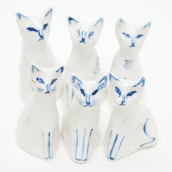 kayeblegvad-ceramics:  Porcelain cats.  Made by Kaye Blegvad.