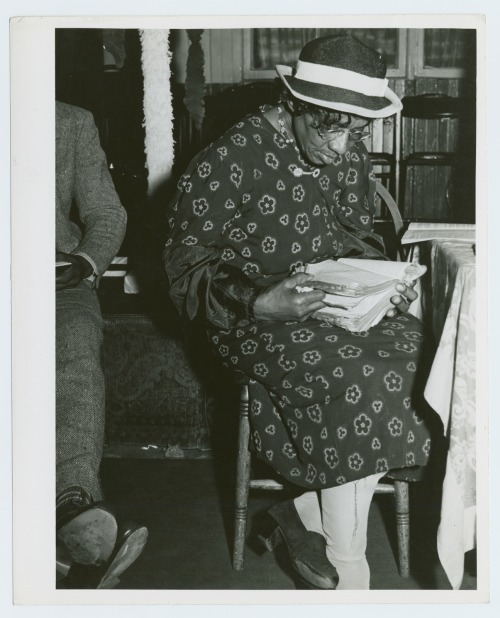 Reading the Bible in the &ldquo;storefront&rdquo; Baptist Church, Chicago, Illinois. 1930′s. Photogr