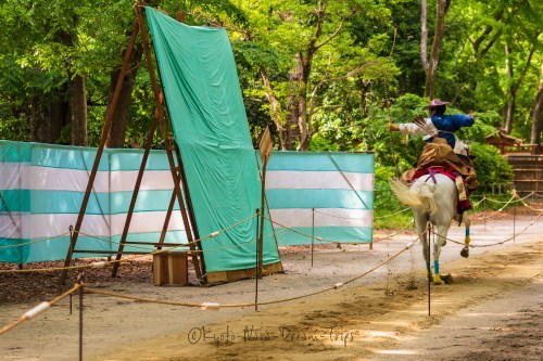 The riders are fully dressed as samurai warriors during the Yabusame Shinji. They wear a costume com