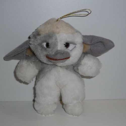 A gray and white bootleg Mogwai plush from France imported by a company called Sandy eBay