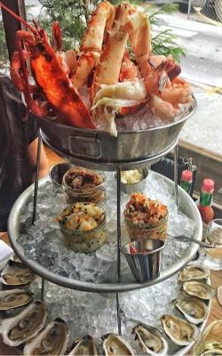 food-porn-diary:  Seafood tower. Includes fresh lobster, king crab legs, shrimp, scallop tartare, salmon tartare, oysters, clams and plenty of horseradish. [OC] [1000x1600]