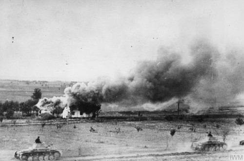 German Panzer II tanks advance past a burning Russian village duringOperation Barbarossa (June – Aug