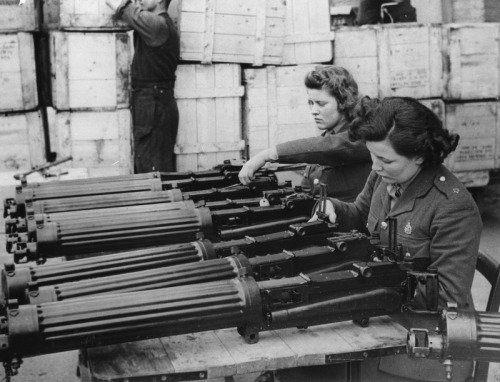 demons:Women in the ordnance depot in England check a new shipment of Vickers machine gun that just 