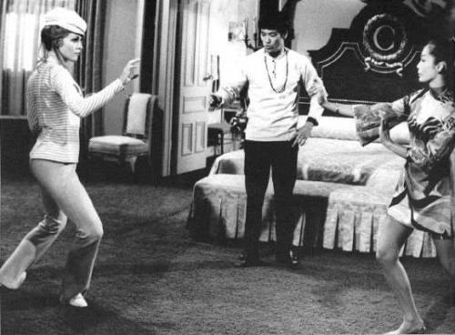 giablo69:  Bruce Lee working with Sharon Tate on the set of the Dean Martin’s Matt Helm film “The Wrecking Crew”, 1969. 