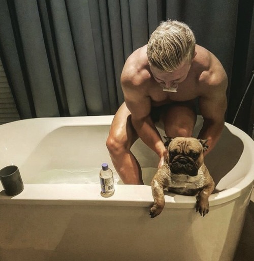 Brodie Robertson - Giving his doggo an unwelcome adult photos