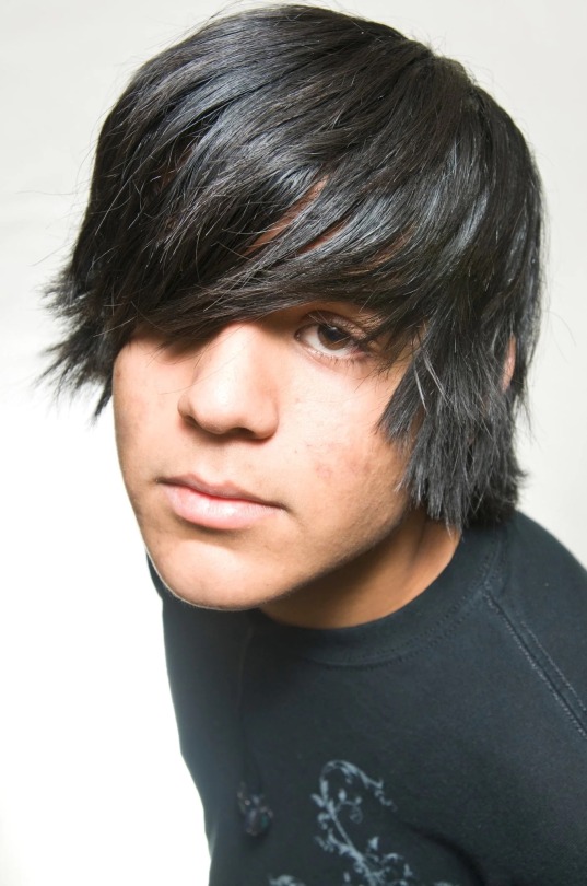 a man with an ugly little emo cut