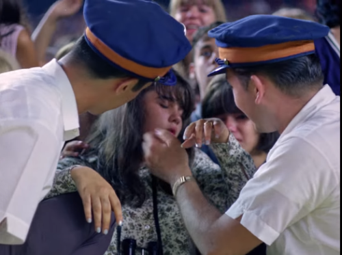 historium: A girl faints at the 1965 Shea Stadium Beatles Concert