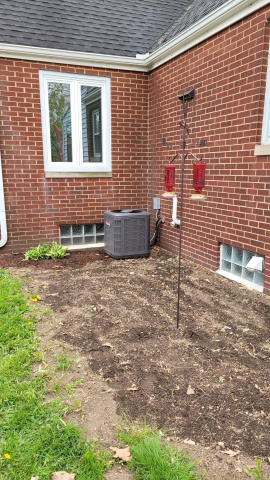 katiiie-lynn:It’s not the prettiest presentation because it still needs work, but spent all day outside weeding the flower beds and finally laying down some mulch. Planted some lilacs outside our reading room windows, planted grass seed by our A/C