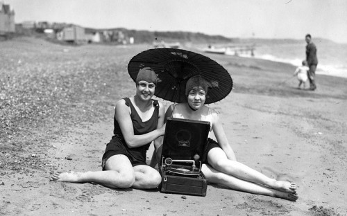 By the 1930s, you could take your gramophone to the beach with you just like these two bathing belle