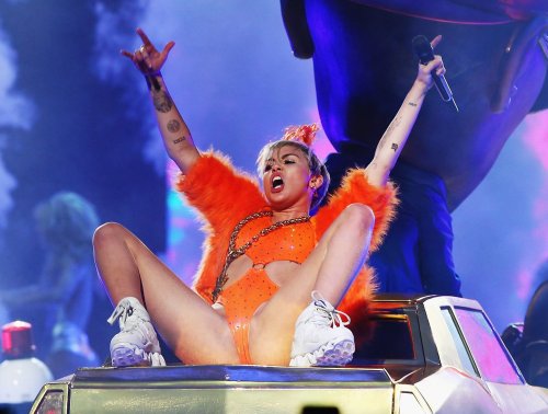 pornwhoresandcelebsluts:  Miley Cyrus does more slutty spread leg crotch shots live in concert on the Bangerz tour