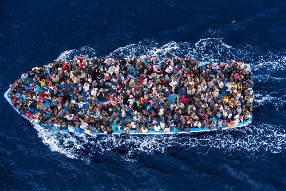 missfolly:  Italian navy rescues asylum seekers traveling by boat off the coast of