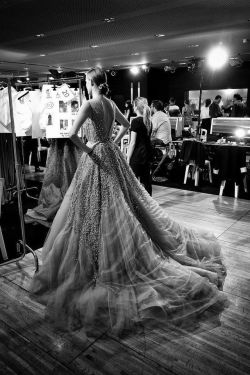naimabarcelona:  A model prepares to walk at the Elie Saab show. 
