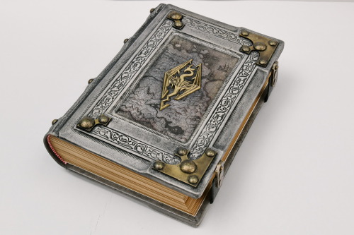  Aged white leather journal with the Skyrim map in the center of the front cover. Over the map is mo