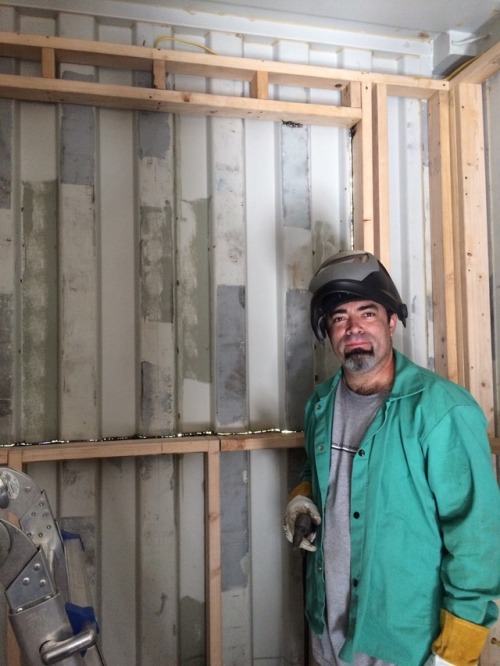 Jorge&rsquo;s cutting out my command center window with a plasma cutter.