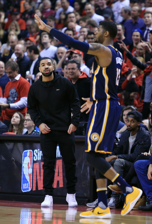 celebritiesofcolor: Drake shouts at Paul George #13 of the Indiana Pacers in the first half against 