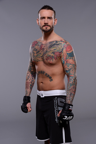 thepunknation:UFC Photoshoot Part One‘DALLAS, TX - MARCH 13:  Phil ‘CM Punk’ Brooks poses for a  photo during a UFC photo session at the Hilton Anatole Hotel on March  13, 2015 in Dallas, Texas. (Photo by Mike Roach/Zuffa LLC/Zuffa LLC via  Getty