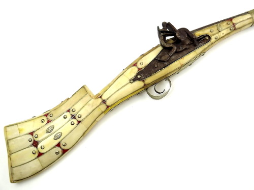Snaphaunce rifle with camel bone mounts, Arab, 19th century.from Sofe Design Auctions
